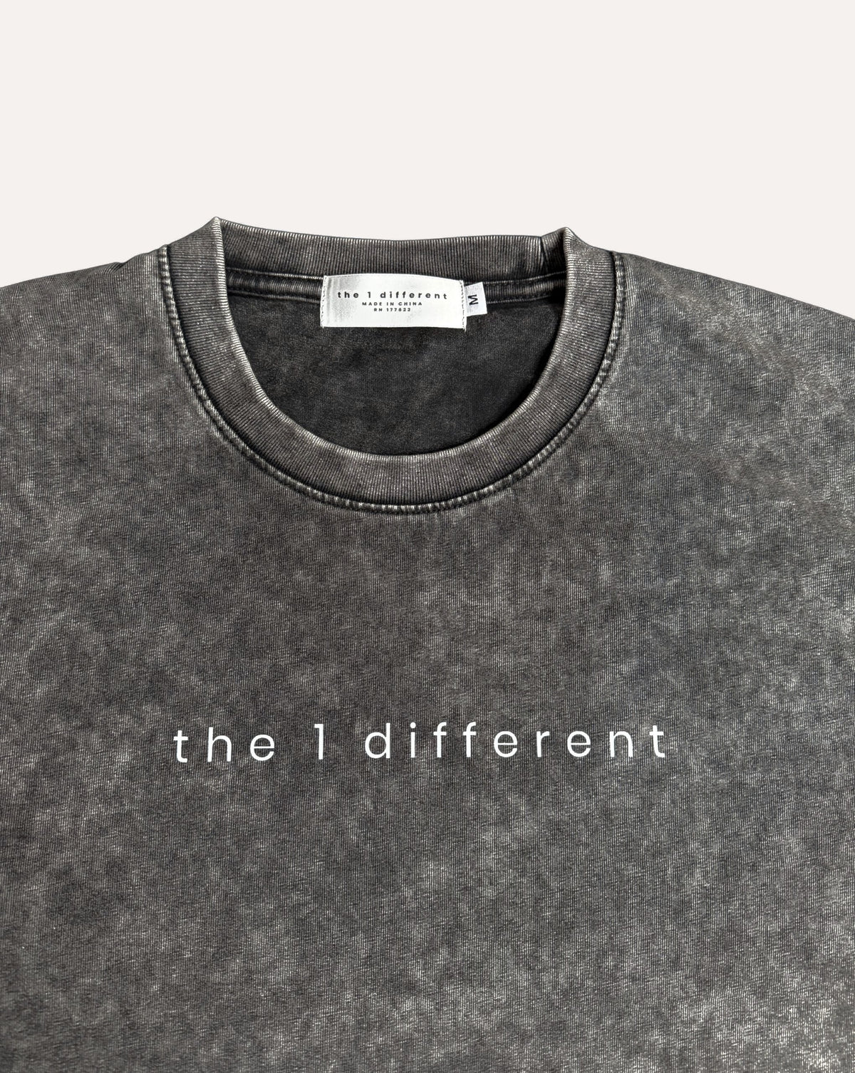Pirate Gray the1different snow-wash tee, collar label and chest print close-up